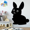 Chalkboard sticker for kids featuring a bunny, perfect for a bright children\'s room with a carpeted floor.