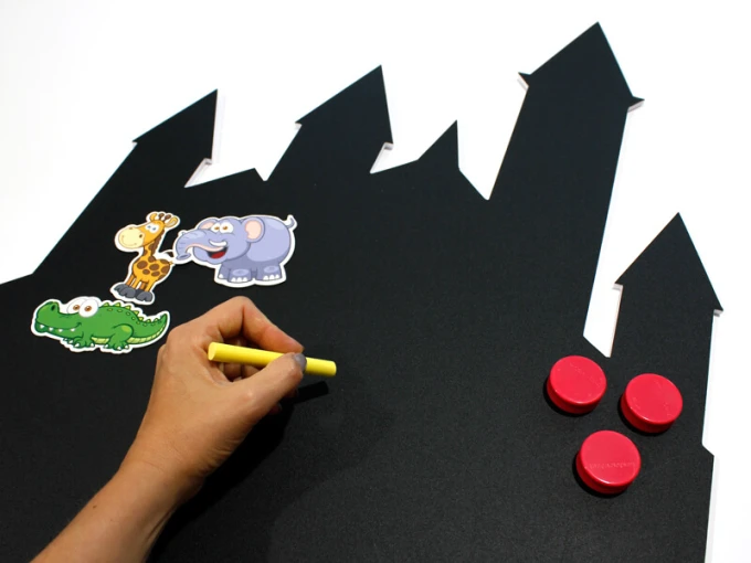 Chalkboard magnetic castle for kids 258 - Black castle-shaped board with cut-out towers.