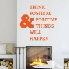Wall sticker with the phrase "Think Positive" 2394 - Living room decor. Light-colored wall, fireplace, and wooden floor.