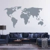 World map wall sticker 06 - Living room arrangement with light-colored walls and dark furniture set.