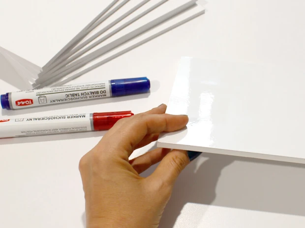 A5 white dry-erase board with a smooth rectangular surface and graphic design.