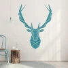 Deer head wall sticker 2415 - Styled in a living room with light-colored walls and Scandinavian furniture.