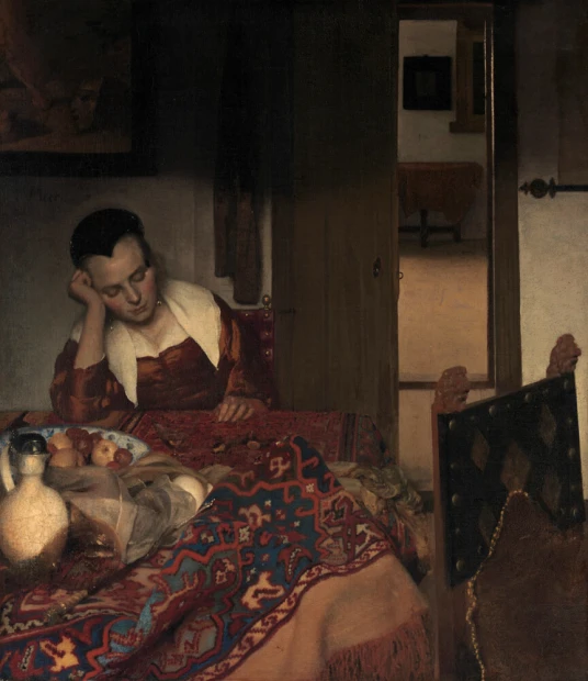 Reproduction of A Maid Asleep by Johannes Vermeer - Kitchen arrangement with light-colored walls and wooden furniture.