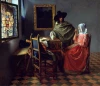 Reproduction of The Glass of Wine by Johannes Vermeer - Kitchen arrangement with blue walls and wooden furniture.