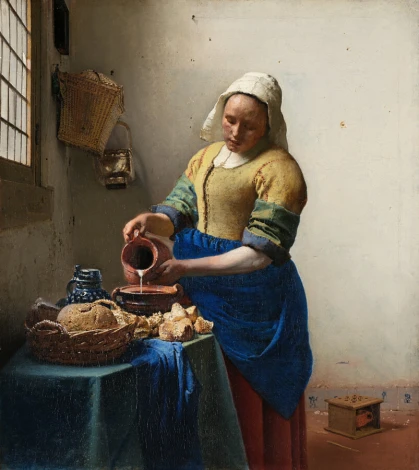 Reproduction of The Milkmaid by Johannes Vermeer - Kitchen setting with light-colored walls and wooden furniture.