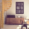 Painting template with the phrase "Finish what you started" - Office decor. Light-colored walls and furniture.
