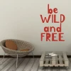 Painting template with the phrase "Be wild and free" 2422 - Living room arrangement with light walls and natural furniture.