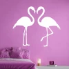 Flamingo wall sticker 2438 - Bedroom decor with pink walls and a bed featuring purple pillows.