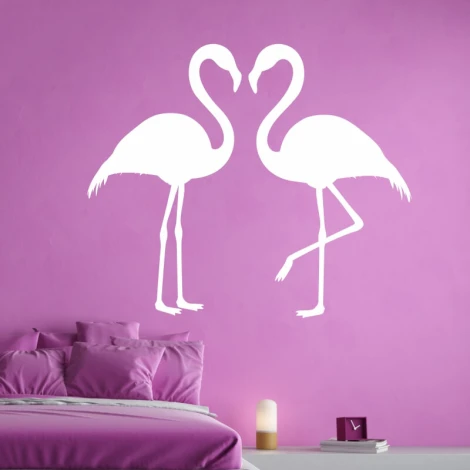 Flamingo wall sticker 2438 - Bedroom decor with pink walls and a bed featuring purple pillows.