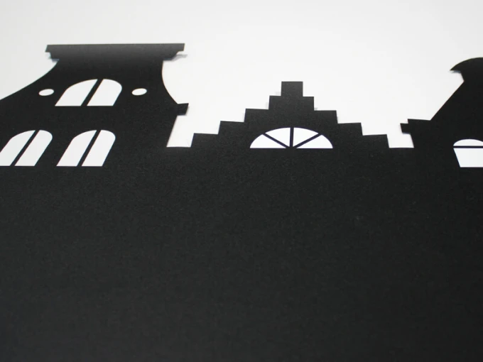 Chalkboard magnetic board houses 246 - Graphic design. Black houses with windows on a white background.
