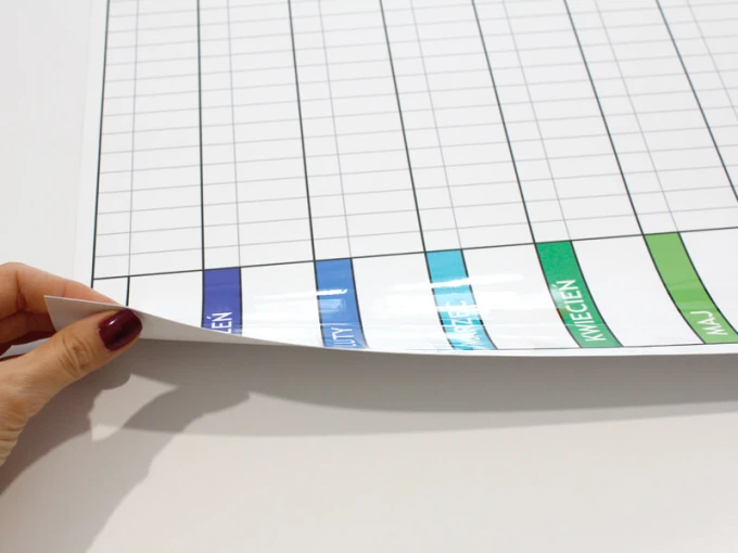 Annual lean planner dry-erase board 040 - Graphic design. Simple grid with colorful month headers.