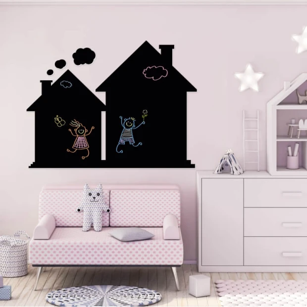 Chalkboard magnetic board for kids\' room. Light-colored walls and pastel furniture create a charming arrangement.