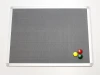 Magnetic pinboard - Graphic design. Gray textured surface with three magnets in yellow.