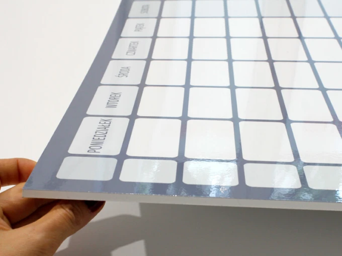 Weekly dry-erase planner with annual planner 267 - Graphic design. Simple grid with rectangles for each day of the week.