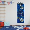 Growth chart sticker 1143 - Decor in a children\'s room. Light-colored walls and a blue rug on the floor.
