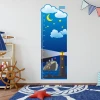 Height chart sticker 1145 - Decor for a child\'s room with light-colored walls, wooden furniture, and a nautical theme.