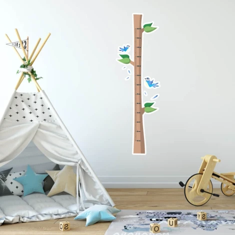 Child growth chart sticker with tree and birds, perfect for a bright children\'s room with white walls and a tipi.