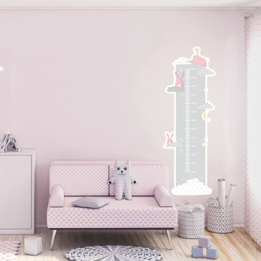 Child growth chart sticker with bunnies and clouds, perfect for a bright children\'s room decor.