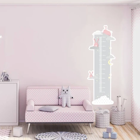 Child growth chart sticker with bunnies and clouds, perfect for a bright children\'s room decor.