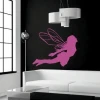 Magical elf sticker 0856 in pink, adding charm to a modern interior with a black wall.
