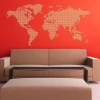 Stylish world map sticker in a modern living room against a vibrant red background, adding character.
