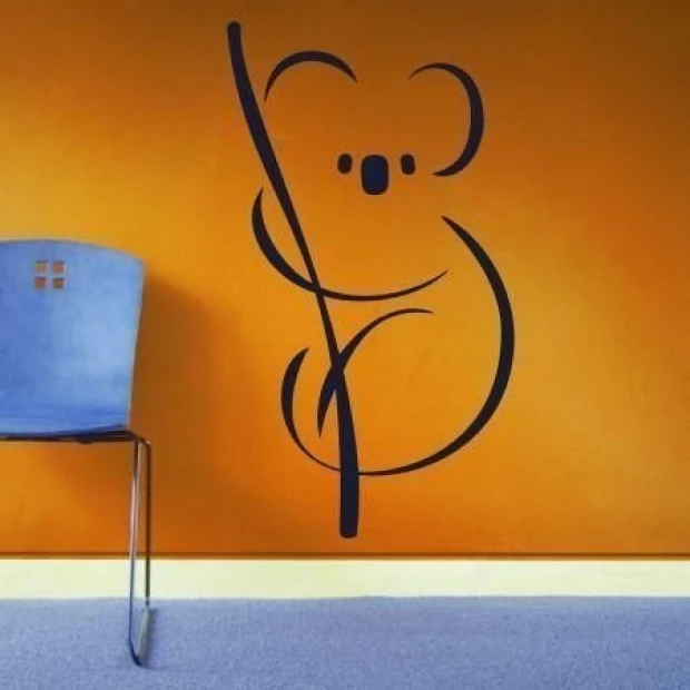 Stylish koala bear in a modern interior, adding coziness to a room with vibrant orange accents.
