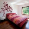 Stylish branch sticker 1030 in warm burgundy shades, perfect for a modern bedroom with a touch of elegance.