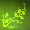 Butterfly branch sticker in vibrant green energizes modern interiors, adding a touch of lightness.