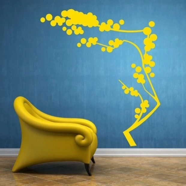 Japanese painting template 28 in vibrant yellow brightens a blue wall in a modern living room.