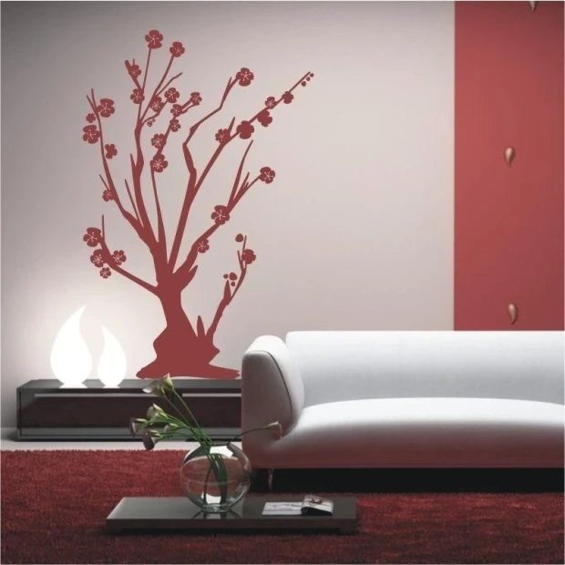 Stylish red tree decor for a modern living room with minimalist furniture.