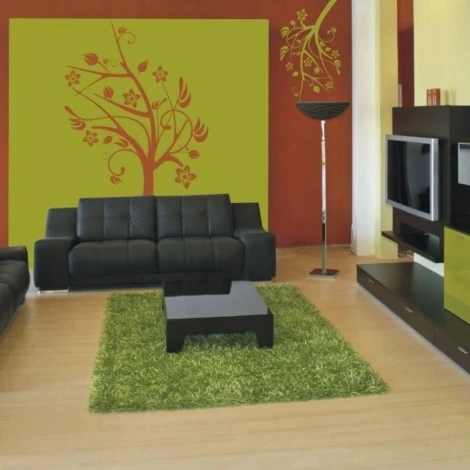 Tree sticker 0951 in a modern living room, integrated into a green wall, adds freshness and harmony.