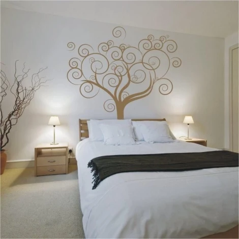 Elegant tree in warm tones on the wall of a cozy bedroom, adding charm and harmony.