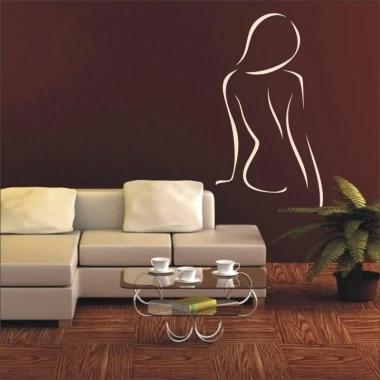 Painting template lady 18 - Living room arrangement. Dark wall with the outline of a female figure next to a sofa.