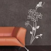 Stylish floral and butterfly sticker, perfect for a modern living room with dark walls and elegant decor.