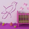 Stylish purple bird on the wall in a colorful children\'s room, perfect for modern decor.