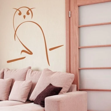 Stylish owl sticker 1265 in warm brown tones, decorating a cozy living room with light furniture.