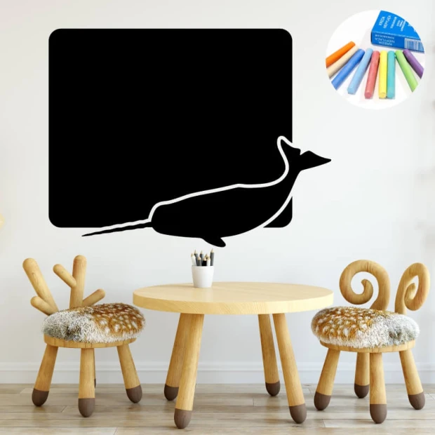 Chalkboard narwhal sticker 350 - Decor for a child\'s room with light-colored walls and wooden furniture.