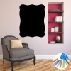 Chalk sticker decorative frame 359 - Living room setup with pink walls, wooden floor, and a chair nearby.