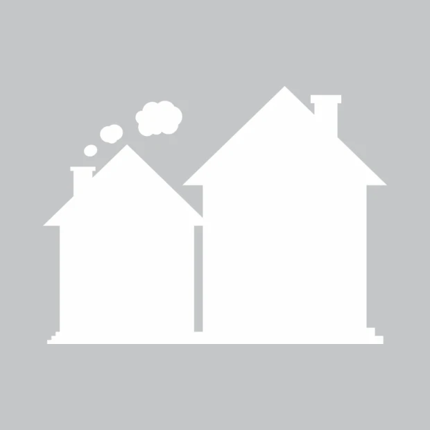 Dry-erase board with two houses in different shapes, one with smoke coming from the chimney.