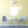 Whiteboard cup 250 - Dining room setup with light-colored walls, round table, and gray chairs.