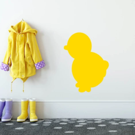 Duck-shaped whiteboard 221 - Decor in a child\'s room. Yellow wall with a gray polka dot rug.