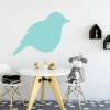 Dry-erase board bird 229 - Dining room setup. Light walls, natural wood table, white chairs.