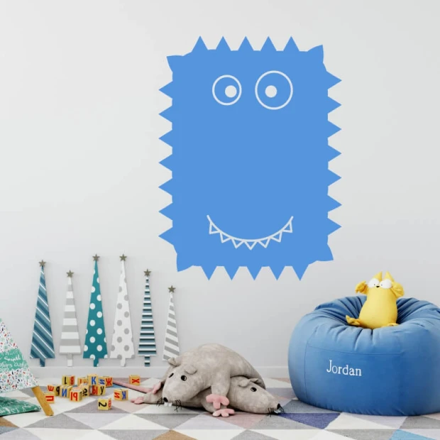 Dry-erase board creature 235 - Decorated in a bright children\'s room with colorful walls, furniture, and toys.