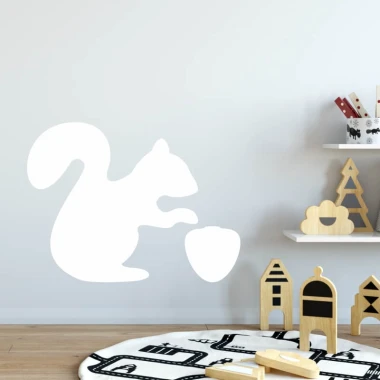 Squirrel-shaped whiteboard with a graphic design of a squirrel holding a nut against a wall background.