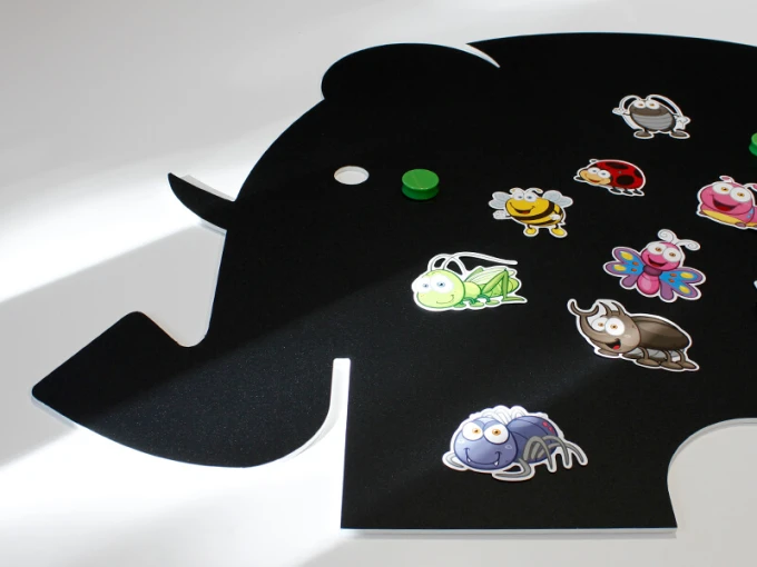 Magnetic chalkboard for kids featuring an elephant design with colorful insects and a green magnet.