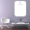 Dry-erase board recommended for living room setup. Light purple walls and minimalist furniture.
