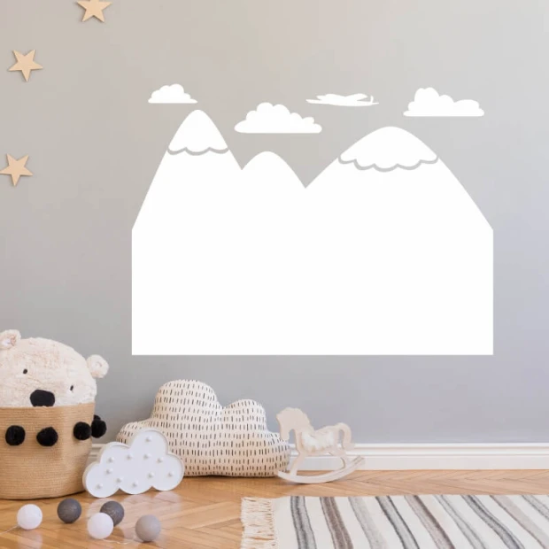 Dry-erase board mountains 285 - Decor in a child\'s room. Light-colored walls, wooden floor, soft toys.