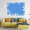Dry-erase board splashes 288 - Living room setup. Yellow sofa with colorful cushions against a white wall.
