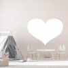 Heart-shaped whiteboard 311 - Decorated in a child\'s room with light walls, wooden floor, and furniture.