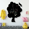 Chalkboard tree 122 - Decorated children\'s room with light-colored walls and a polka dot rug on the floor.